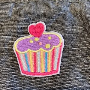 Very cute NWOT cupcake appliqué iron on.